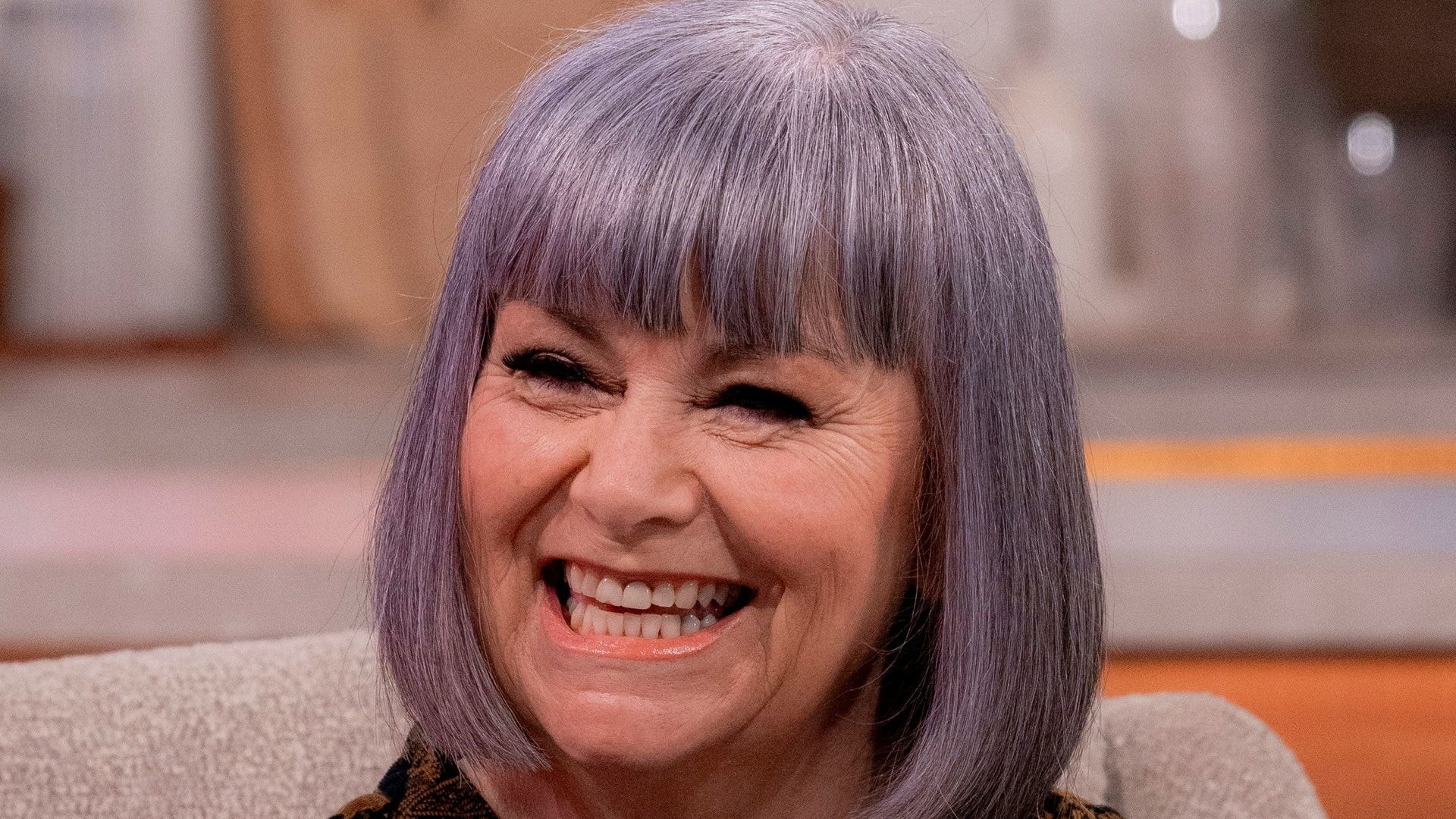 dawn french chatting on sofa