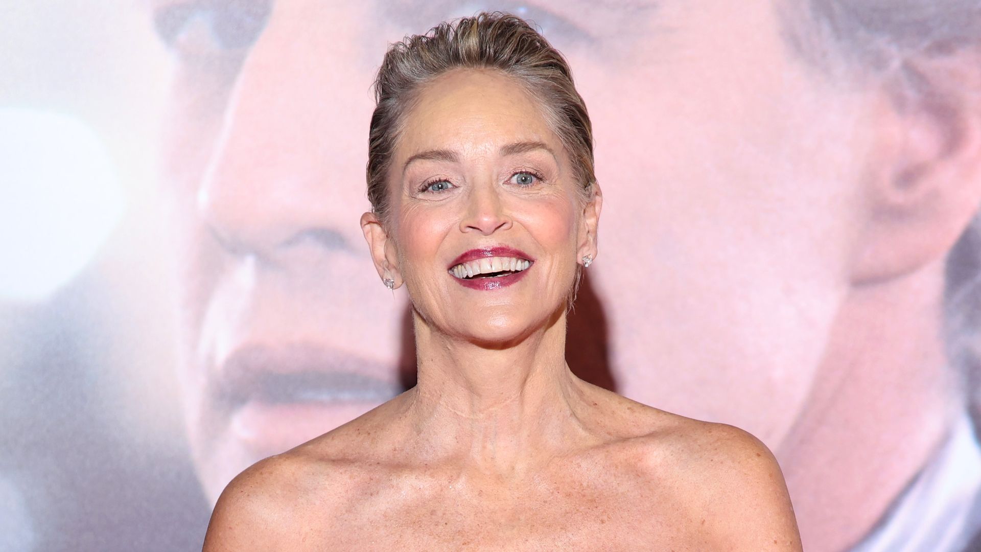 photo of sharon stone in strapless red dress with red feather jacket