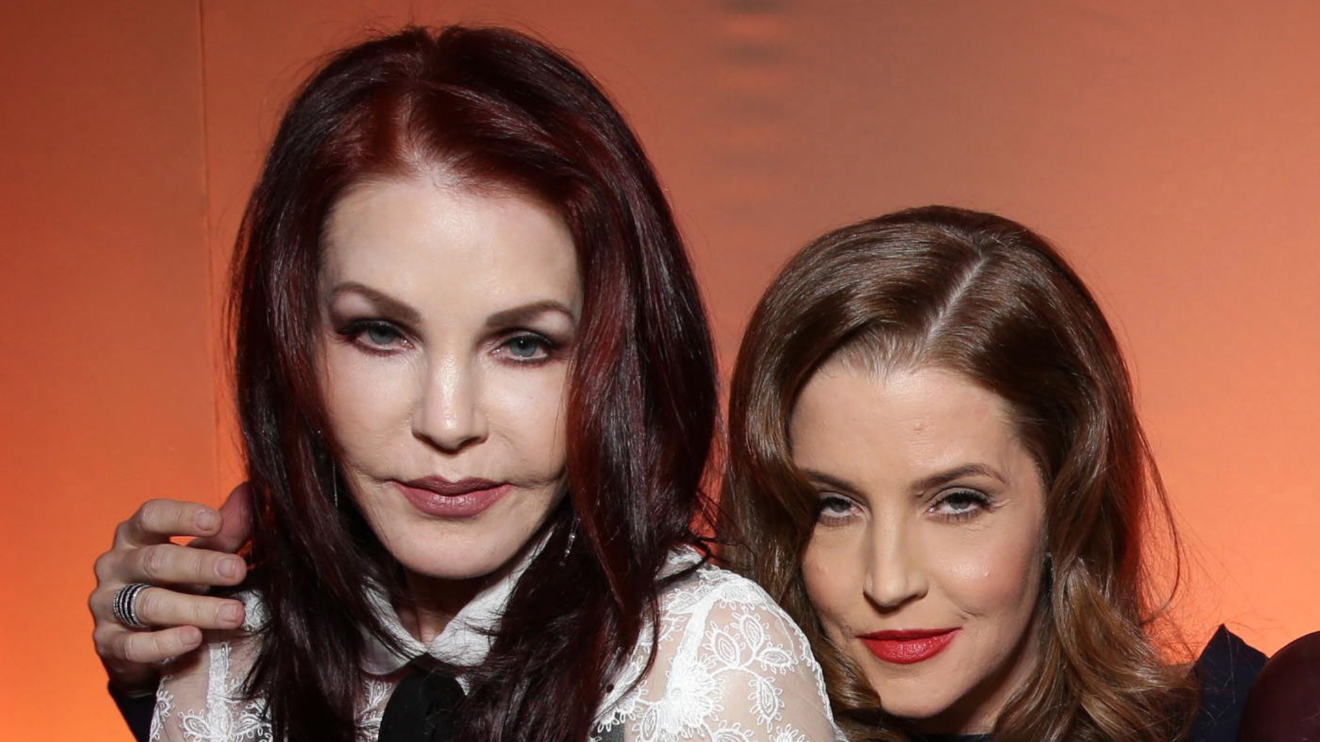 photo of priscilla presley and lisa marie presley sitting down 