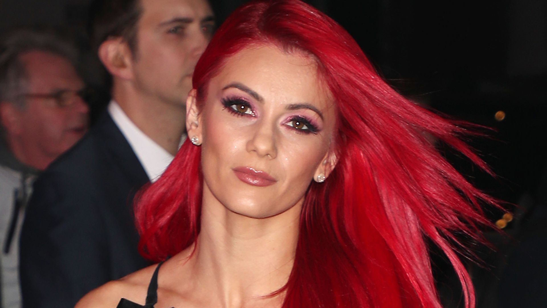 Dianne Buswell in a sequin dress with red hair on the red carpet of Pride of Britain 2019