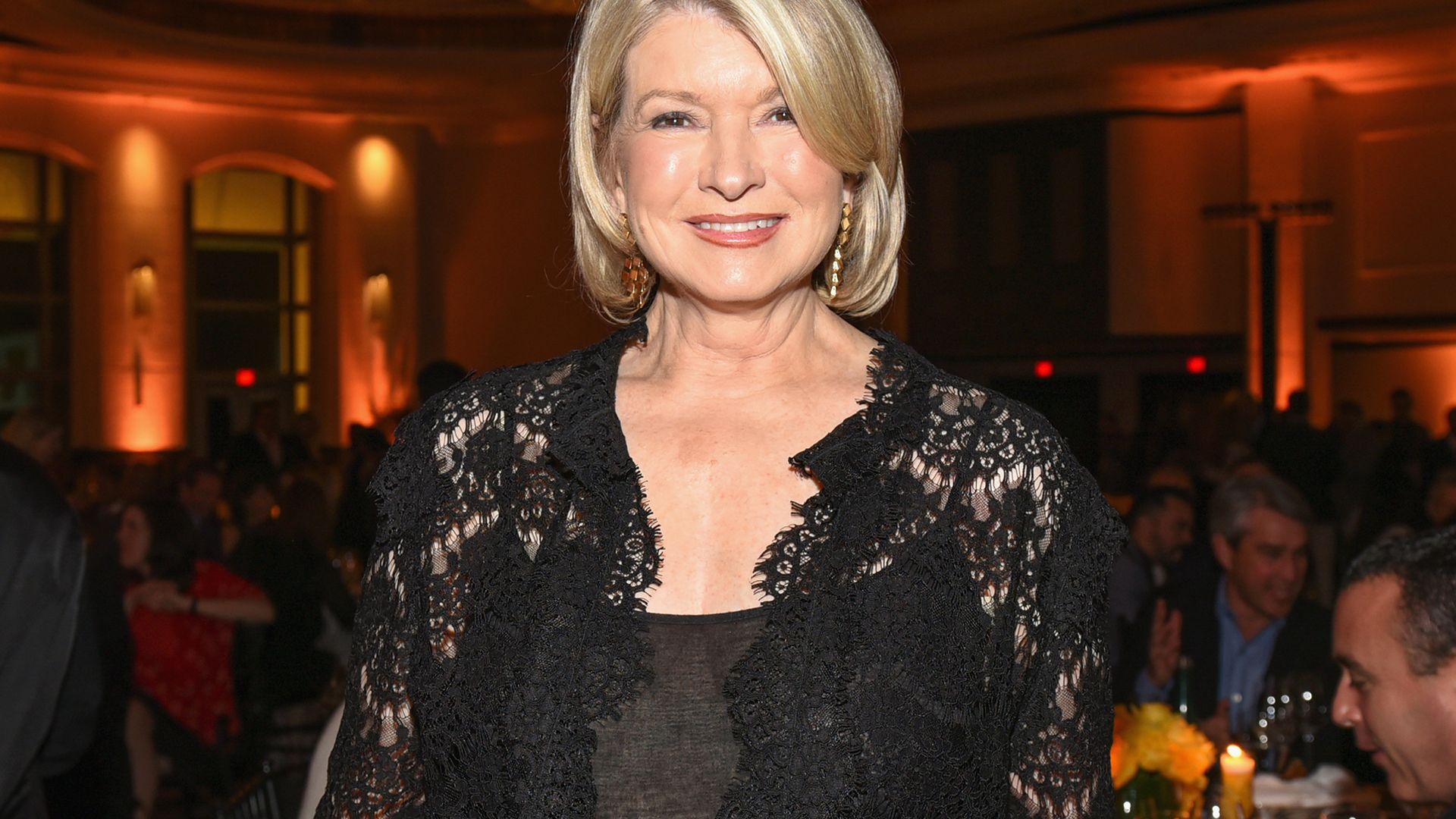 Martha Stewart with glowing skin wearing black lace
