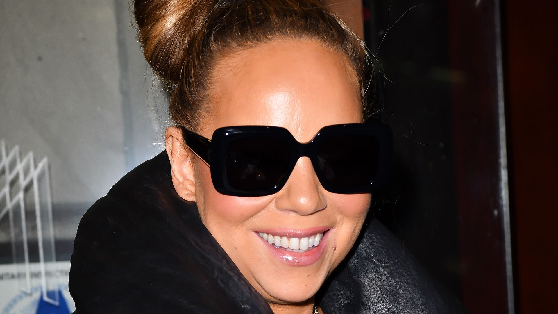 Close up of Mariah Carey wearing sunglasses