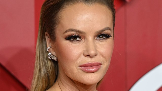 Amanda Holden in a red dress with her hair scraped back