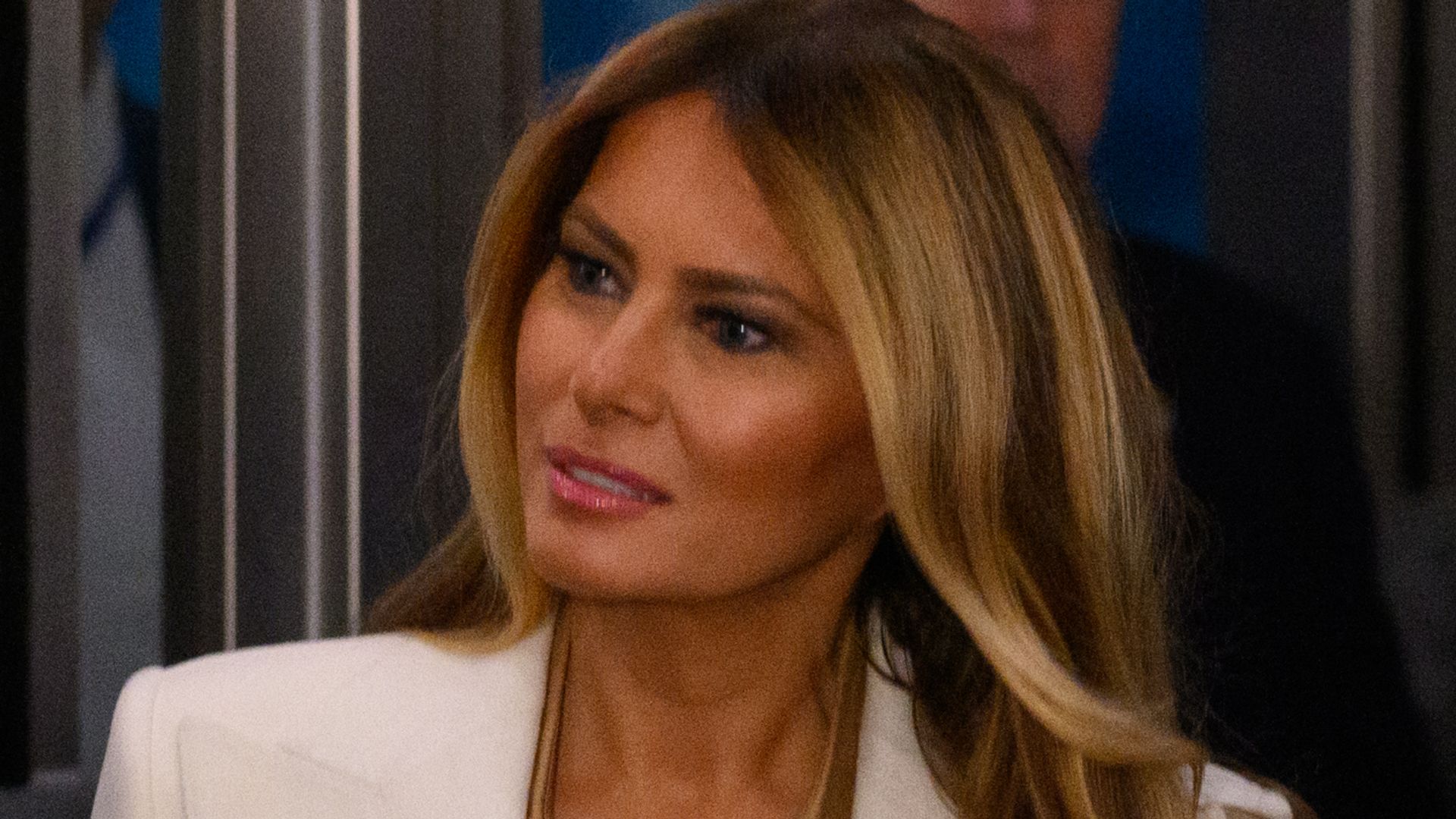 Melania Trump in white blazer and nude shirt