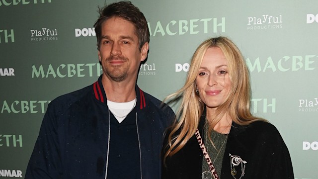 Jesse Wood standing with Fearne Cotton at a premiere