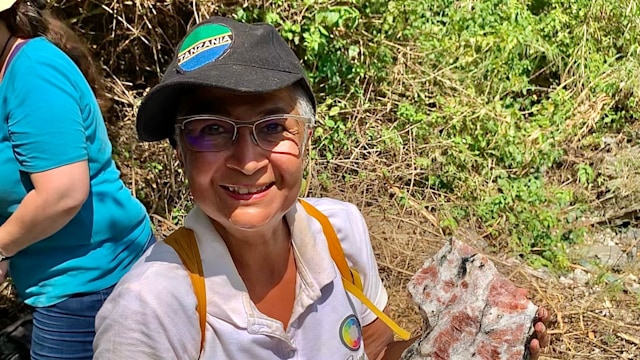 Lady holding a gem stone 