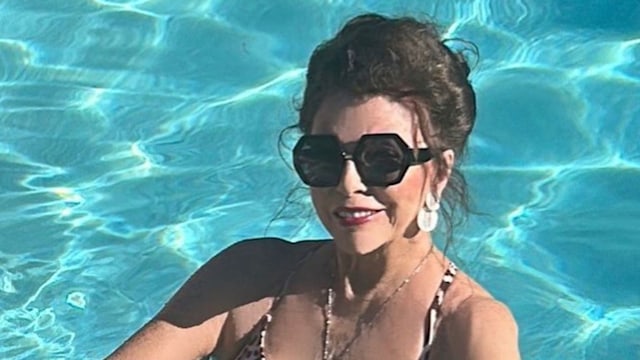 Joan Collins in an animal-print swimsuit