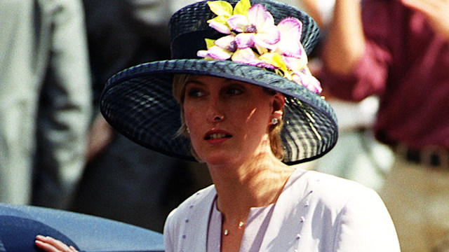 Duchess Sophie in a purple dress getting into a car