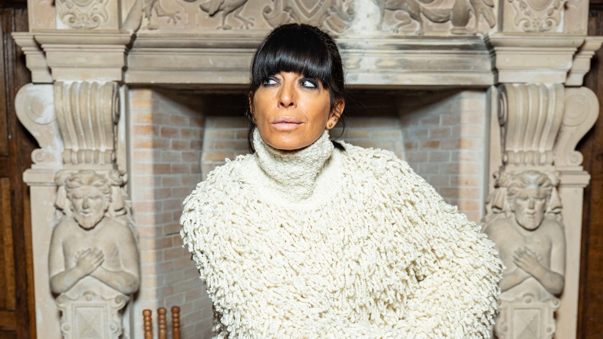 Claudia Winkleman shaggy cream coat on The Celebrity Traitors