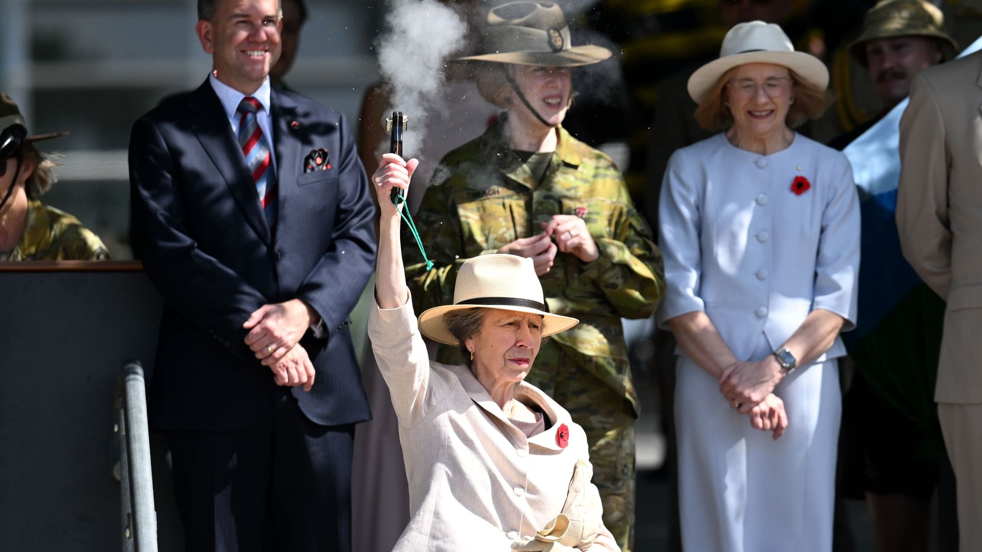 Princess Anne firing a starting pistol in the air