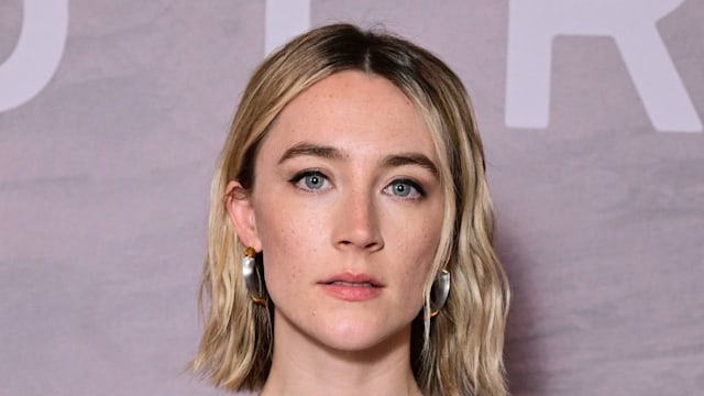 saoirse ronan posing in plunging jumpsuit