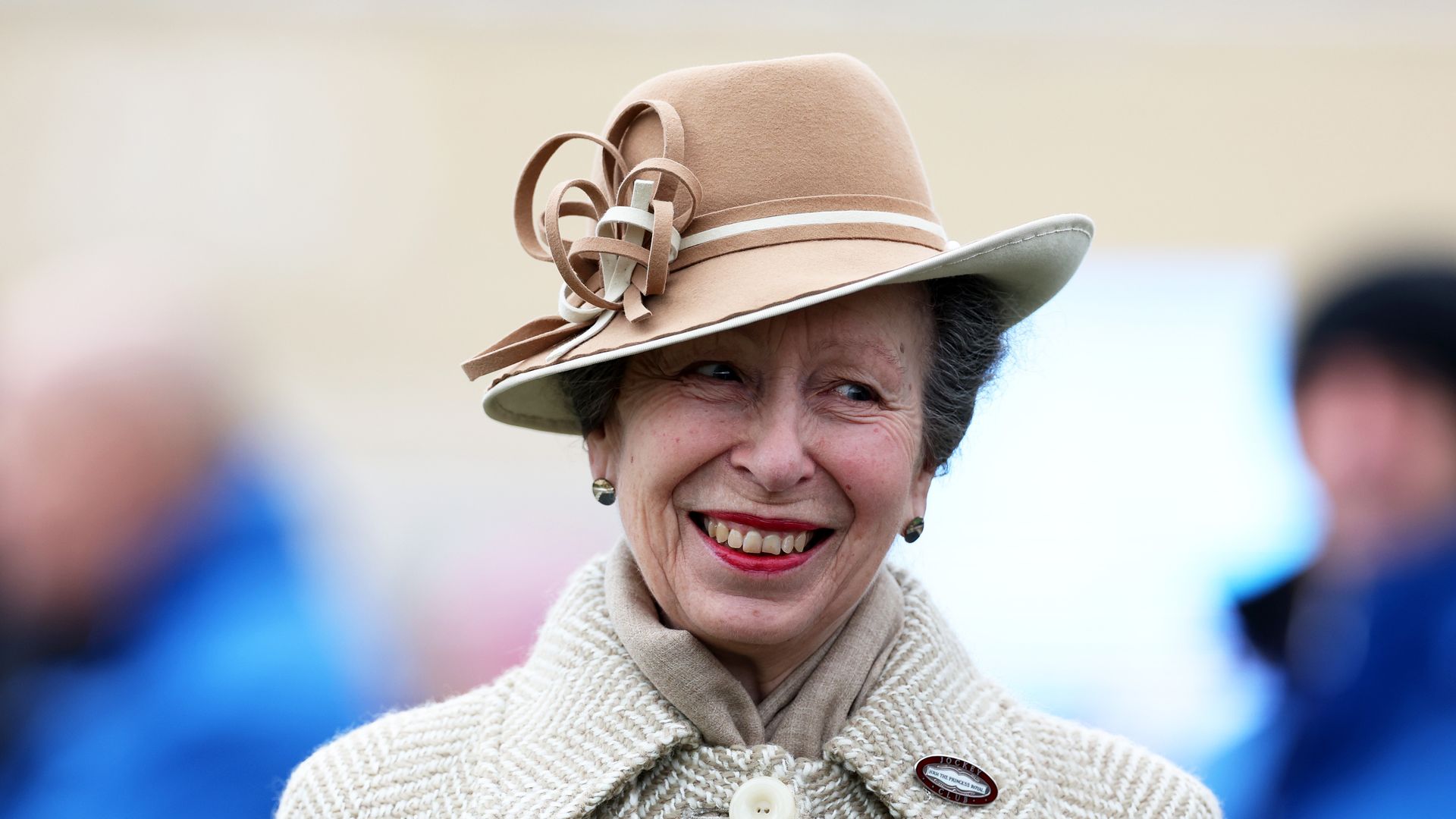 The Princess Royal smiling in neutral hat and coat