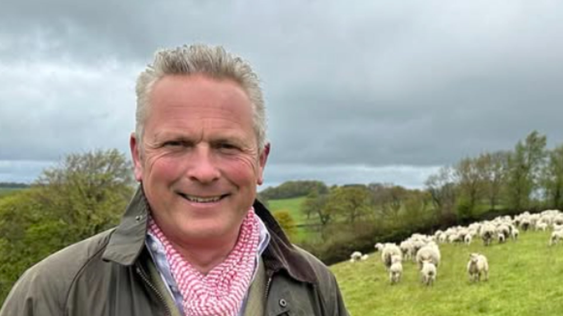 jules-hudson-in-waistcoat-coat-in-sheep-field