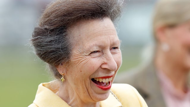 Princess Anne laughing in yellow linen jacket