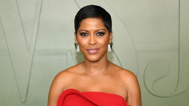 Tarmon Hall stuns in a red dress