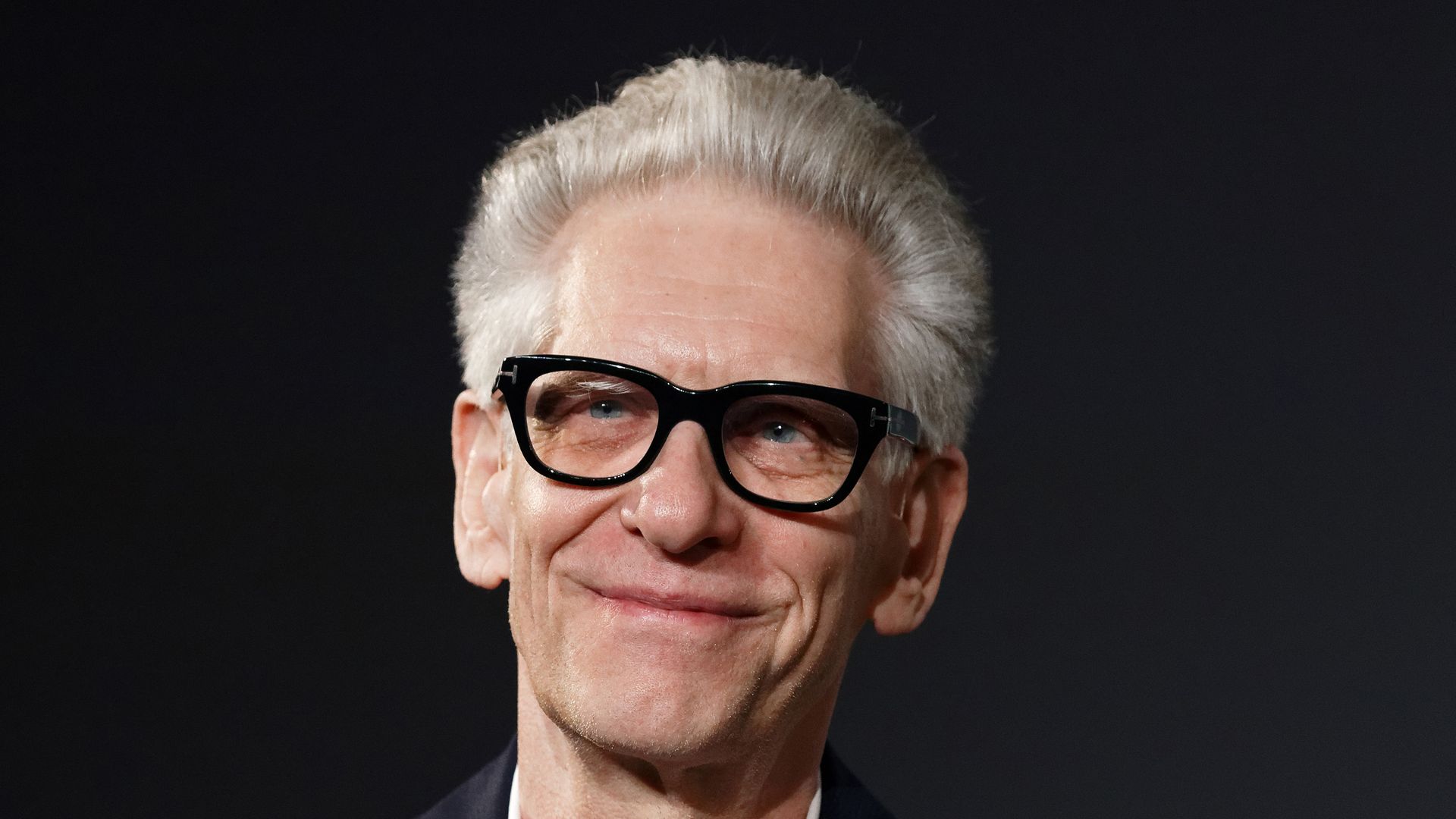David Cronenberg smiling in pair of glasses