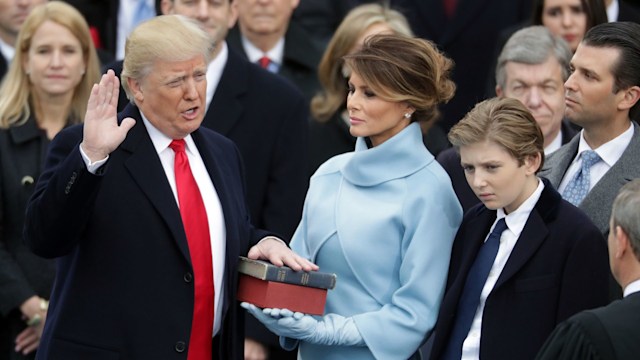 U.S. President Donald Trump takes the oath of office as his wife Melania Trump holds the bible and his son Barron Trump looks on, on the West Front of the U.S. Capitol on January 20, 2017 in Washington, DC. In today's inauguration ceremony Donald J. Trump becomes the 45th president of the United States