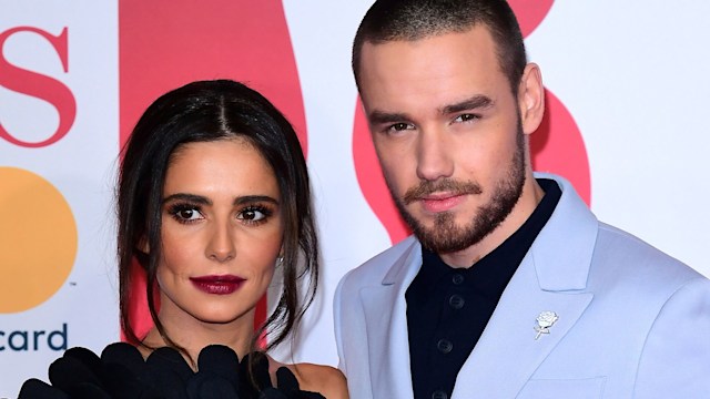 Liam Payne in a blue jacket with Cheryl Cole in a black one-shoulder dress