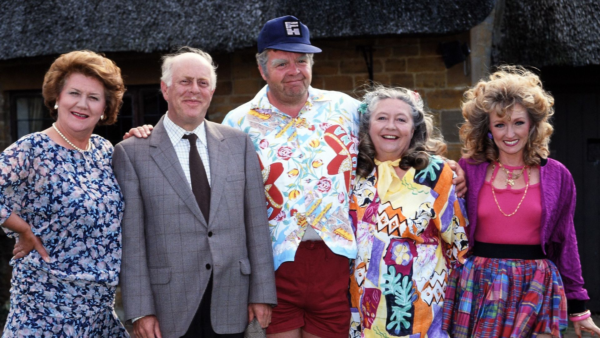 Patricia Routledge, Clive Swift, Geoffrey Hughes, Judy Cornwell and Mary Millar standing together in Keeping Up Appearances