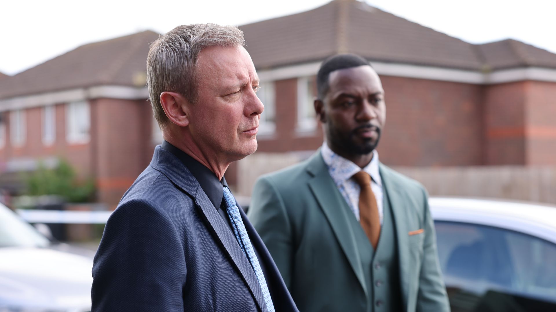 John Simm as DS Roy Grace and Richie Campbell as DS Glenn Branson in Grace
