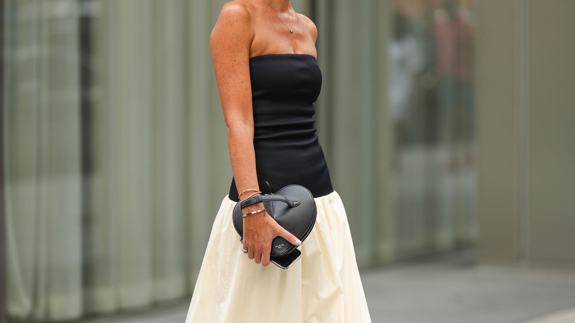 woman in low waist monochrome dress