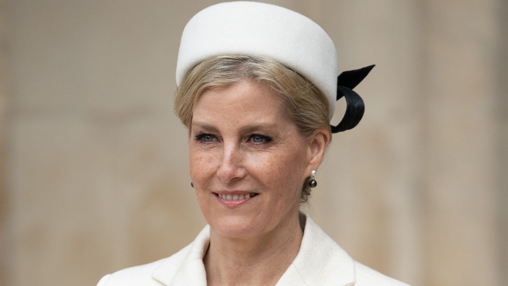 Duchess Sophie rocks brunette pixie cut and thigh split wedding guest skirt in unearthed photo