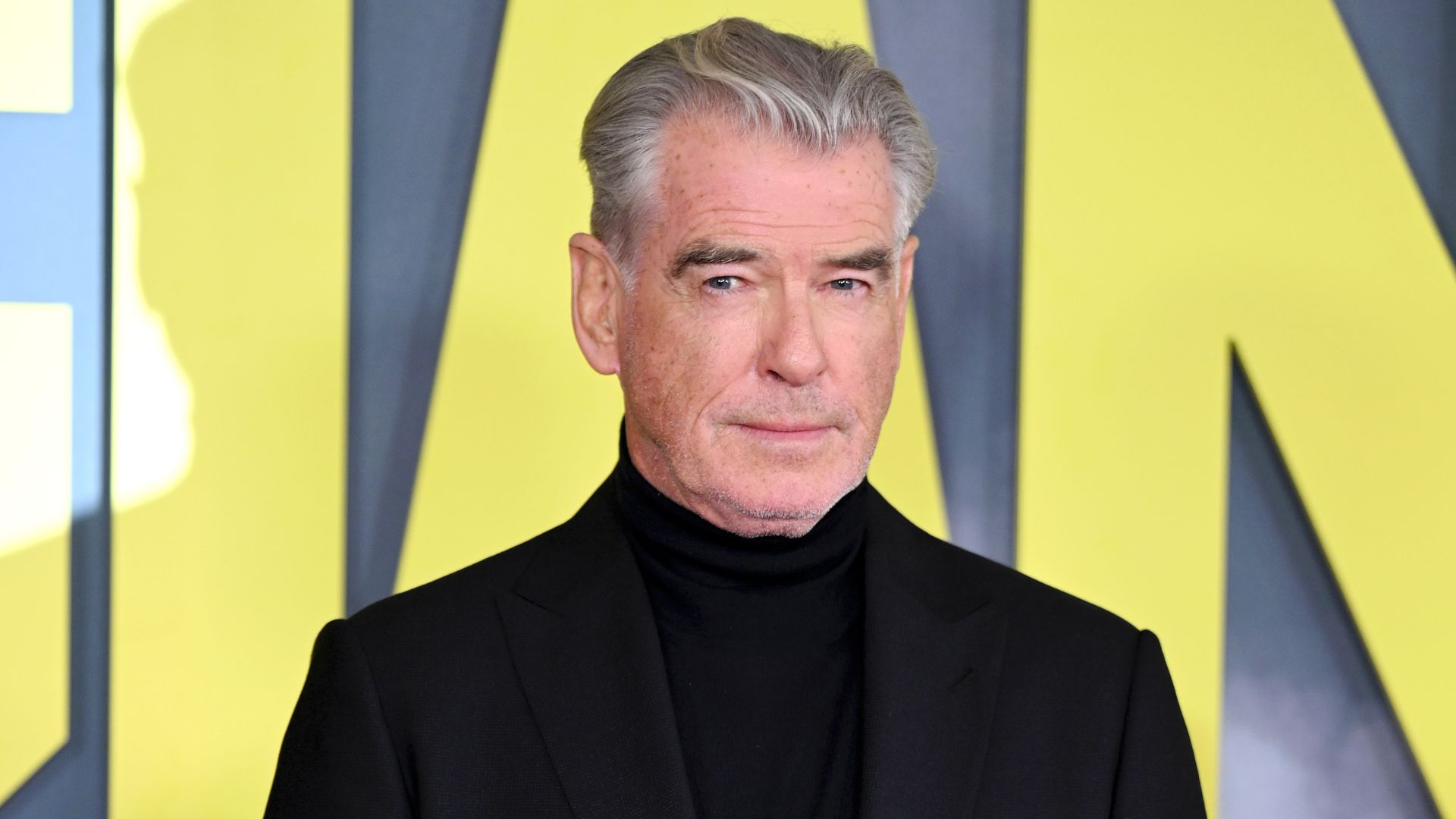 Pierce Brosnan brings suave sophistication to the red carpet as he leads arrivals for Giant premiere