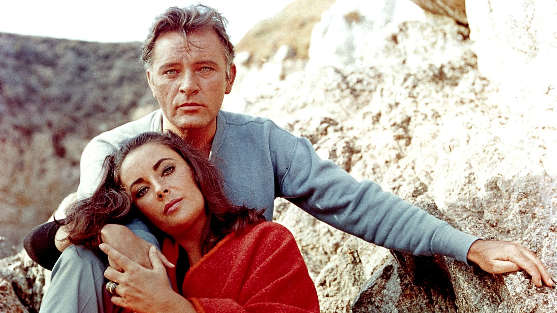 Elizabeth Taylor and Richard Burton  sat next to each other 