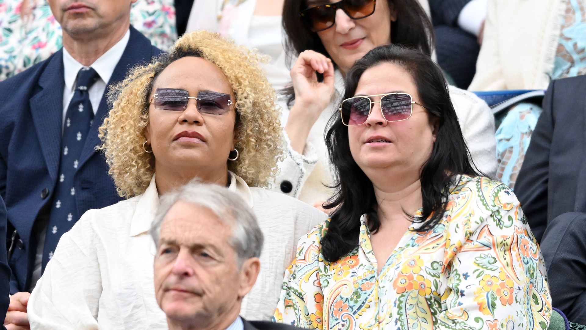 two women watching wimbledon tennis