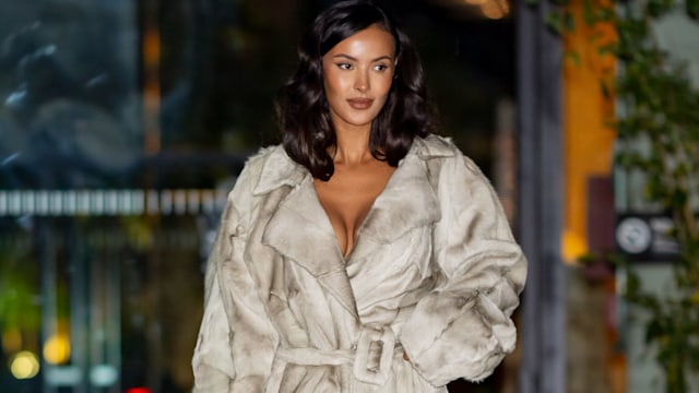 maya jama in a long brown fur coat