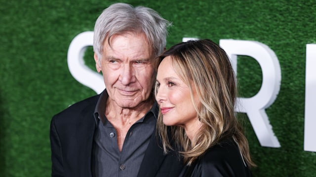 Harrison Ford and wife Calista Flockhart smile together while posing for photographs at the premiere of Shrinking season 2