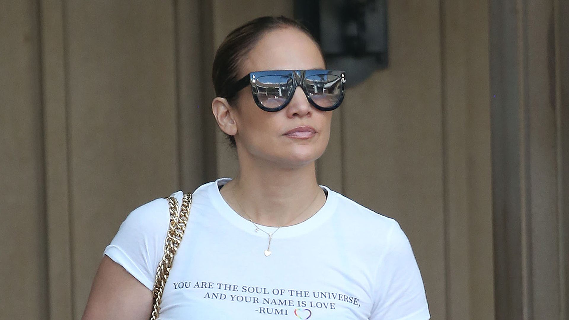 Jennifer Lopez in white tshirt black leggings and sunglasses