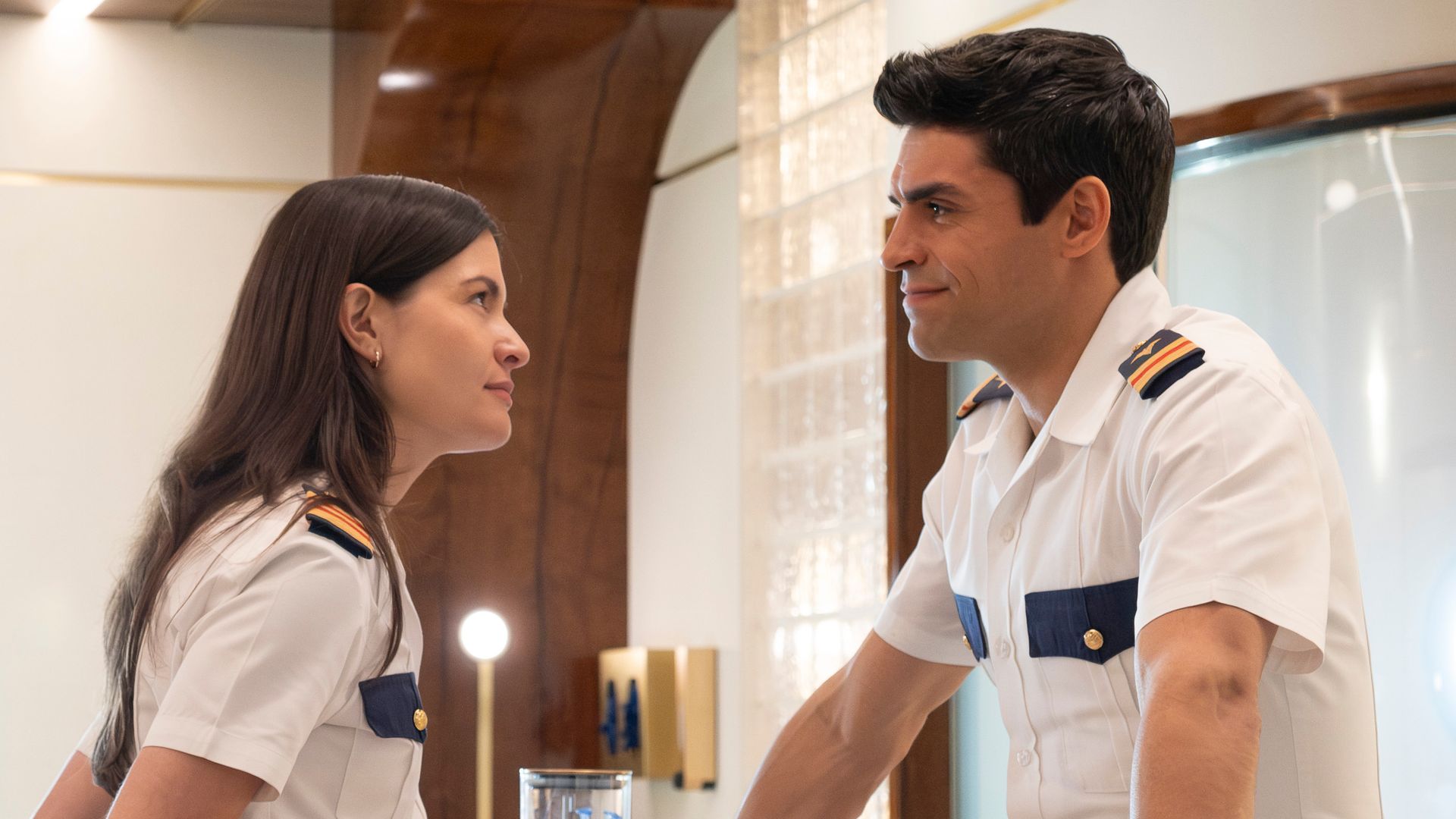 man and woman in uniform standing opposite each other