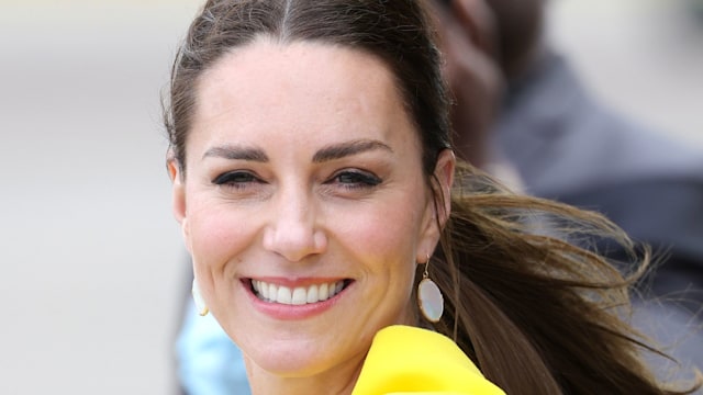 Kate Middleton wearing yellow during the official arrival at Norman Manley International Airport on March 22, 2022 in Kingston, Jamaica. The Duke and Duchess of Cambridge are visiting Belize, Jamaica and The Bahamas on behalf of Her Majesty The Queen on the occasion of the Platinum Jubilee. The 8 day tour takes place between Saturday 19th March and Saturday 26th March and is their first joint official overseas tour since the onset of COVID-19 in 2020.