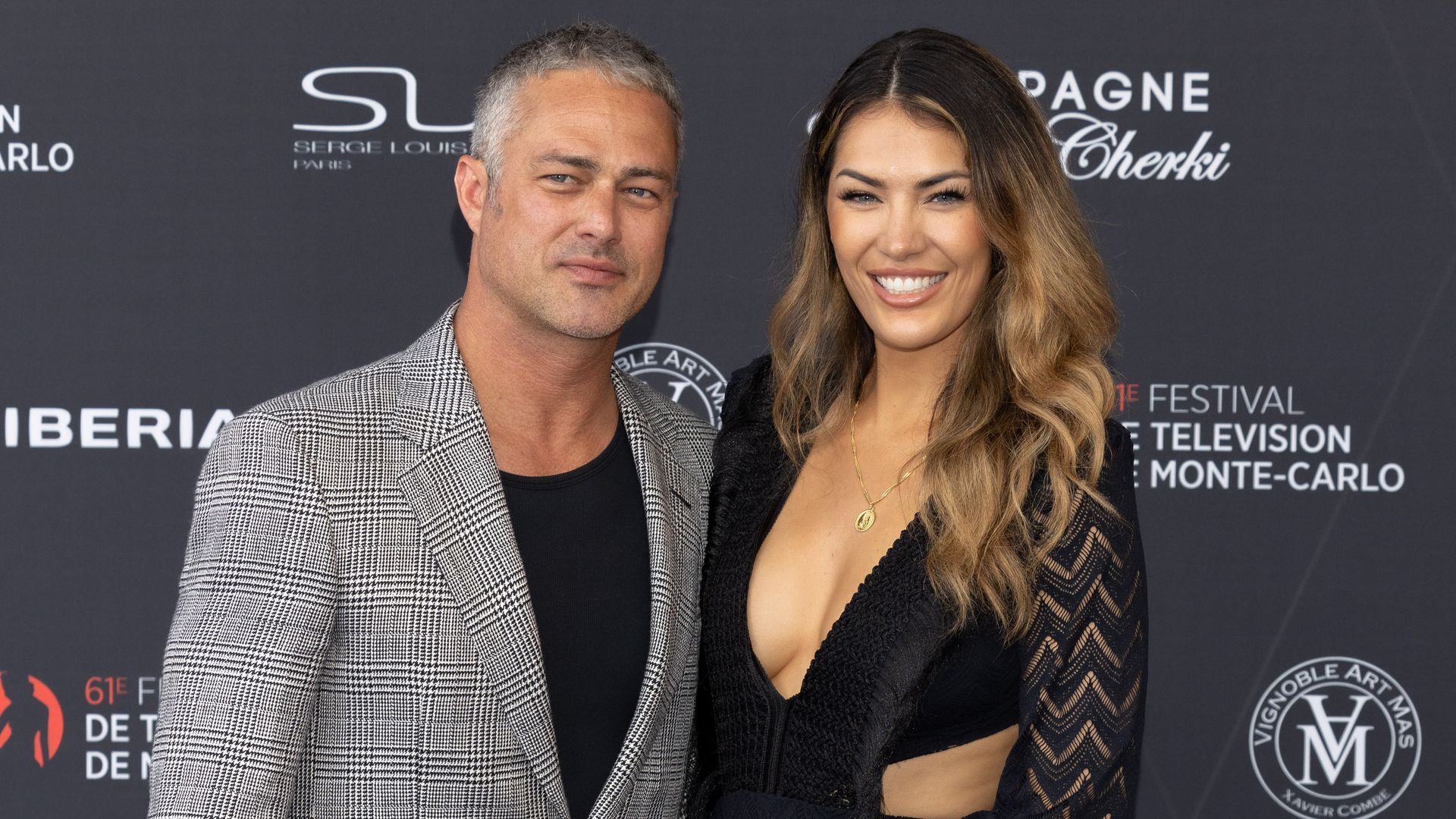 Taylor Kinney and Ashley Cruger attends the opening ceremony during the 61st Monte Carlo TV Festival on June 17, 2022