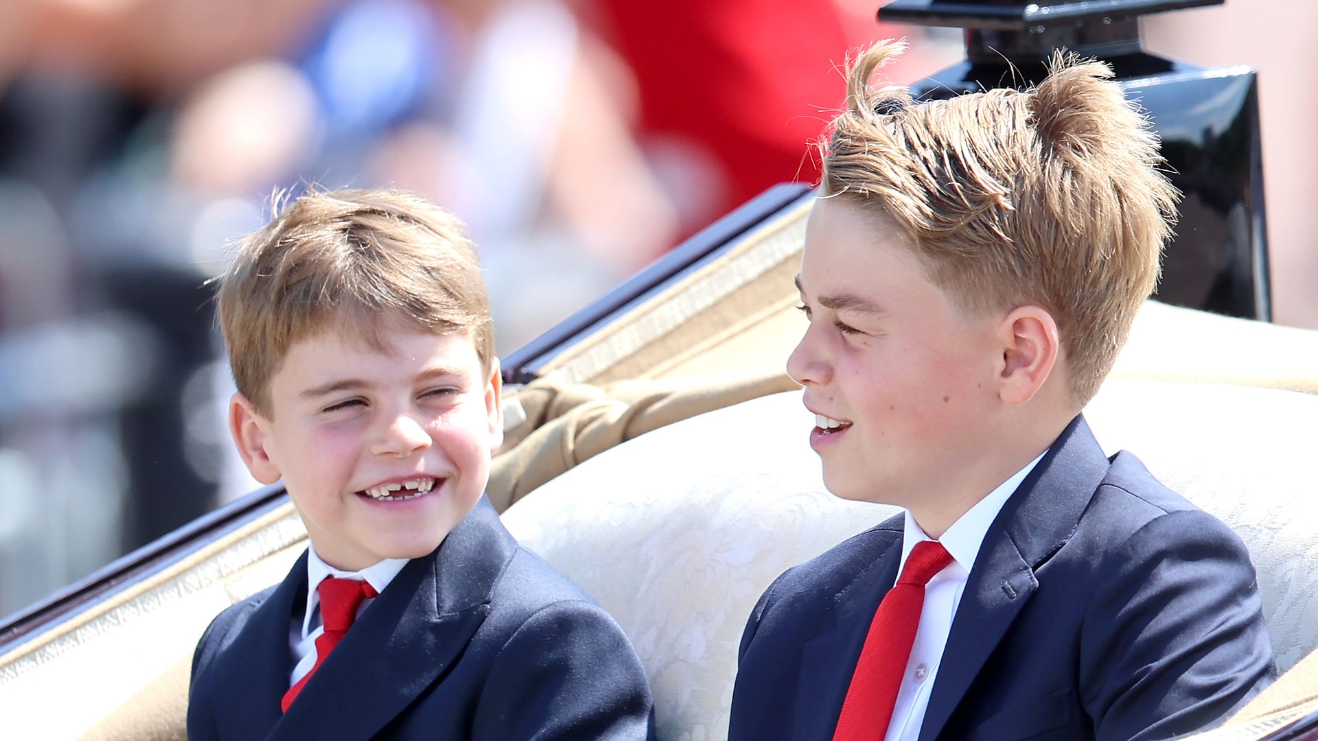 Prince George and Prince Louis travel by carriage during Trooping The Colour