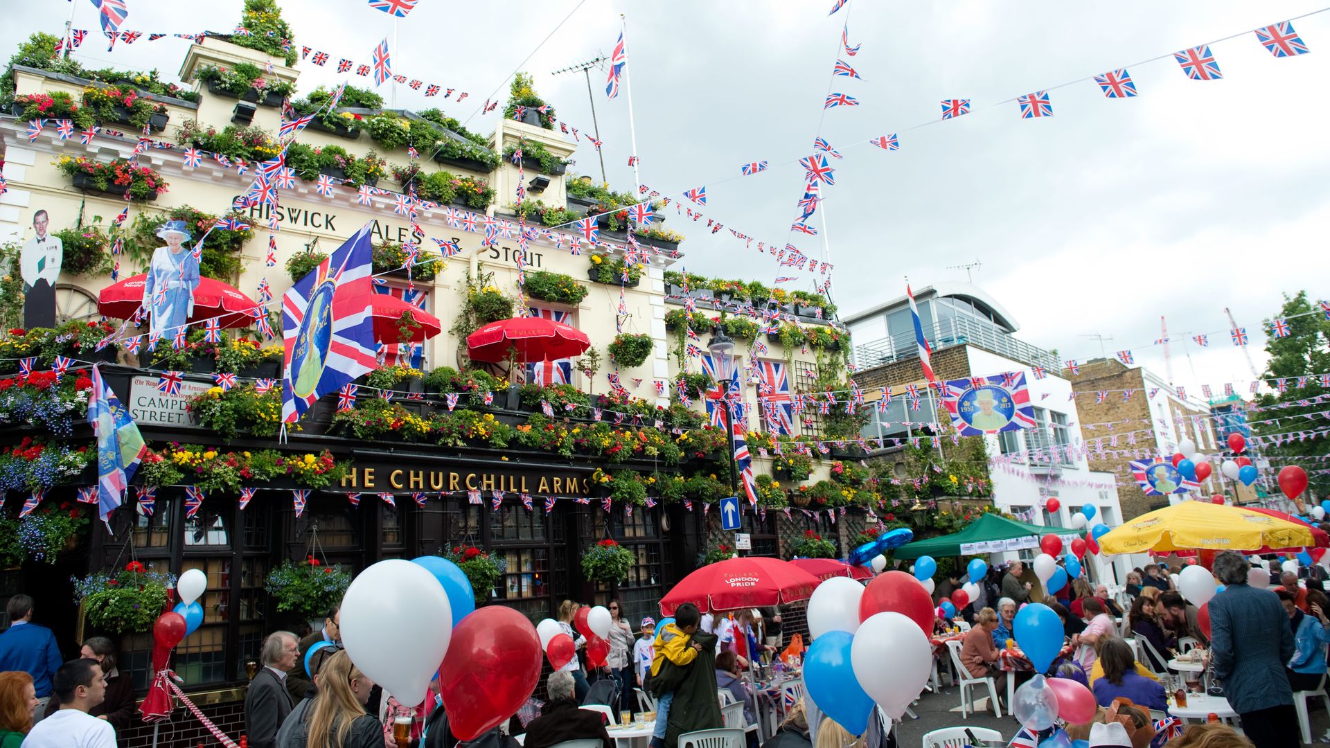 LONDON, ENGLAND - JUNE 4: Residents enjoy a street party in Kensington during the Queen's Diamond Jubilee celebrations on June 4, 2012 in London, England. For only the second time in its history the UK celebrates the Diamond Jubilee of a monarch. (Photo b