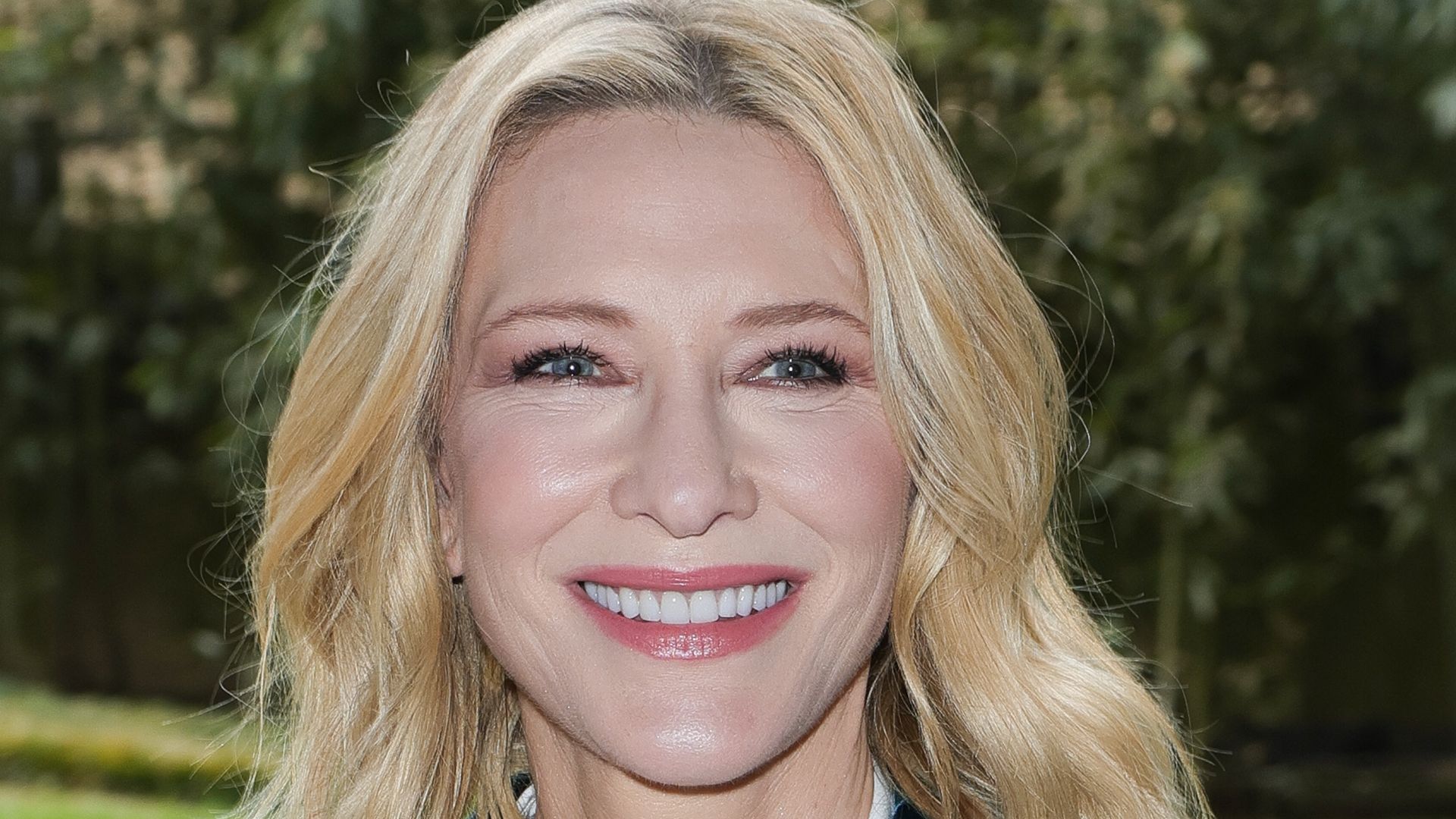 Cate Blanchett smiling in velvet suit