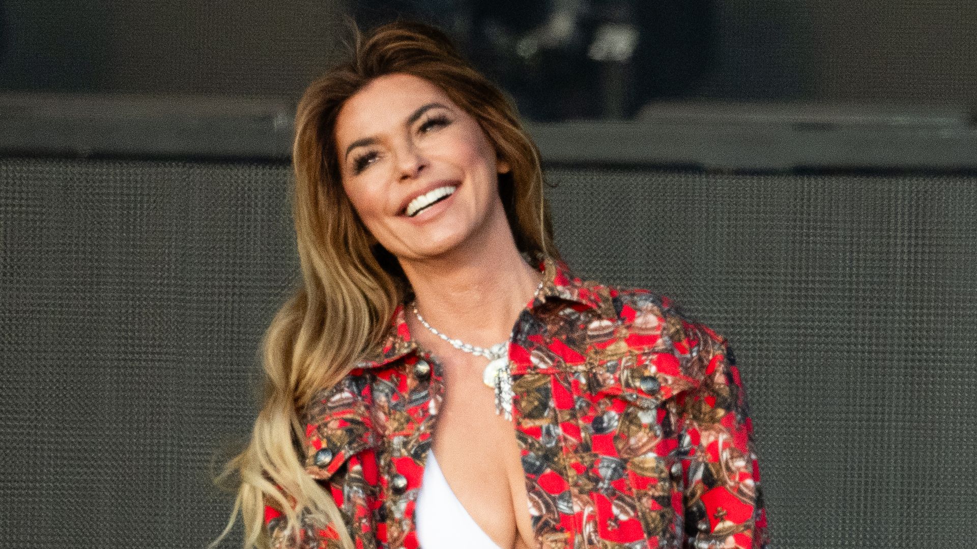 Shania Twain wows crowds in tweed mini skirt paired with sparkling