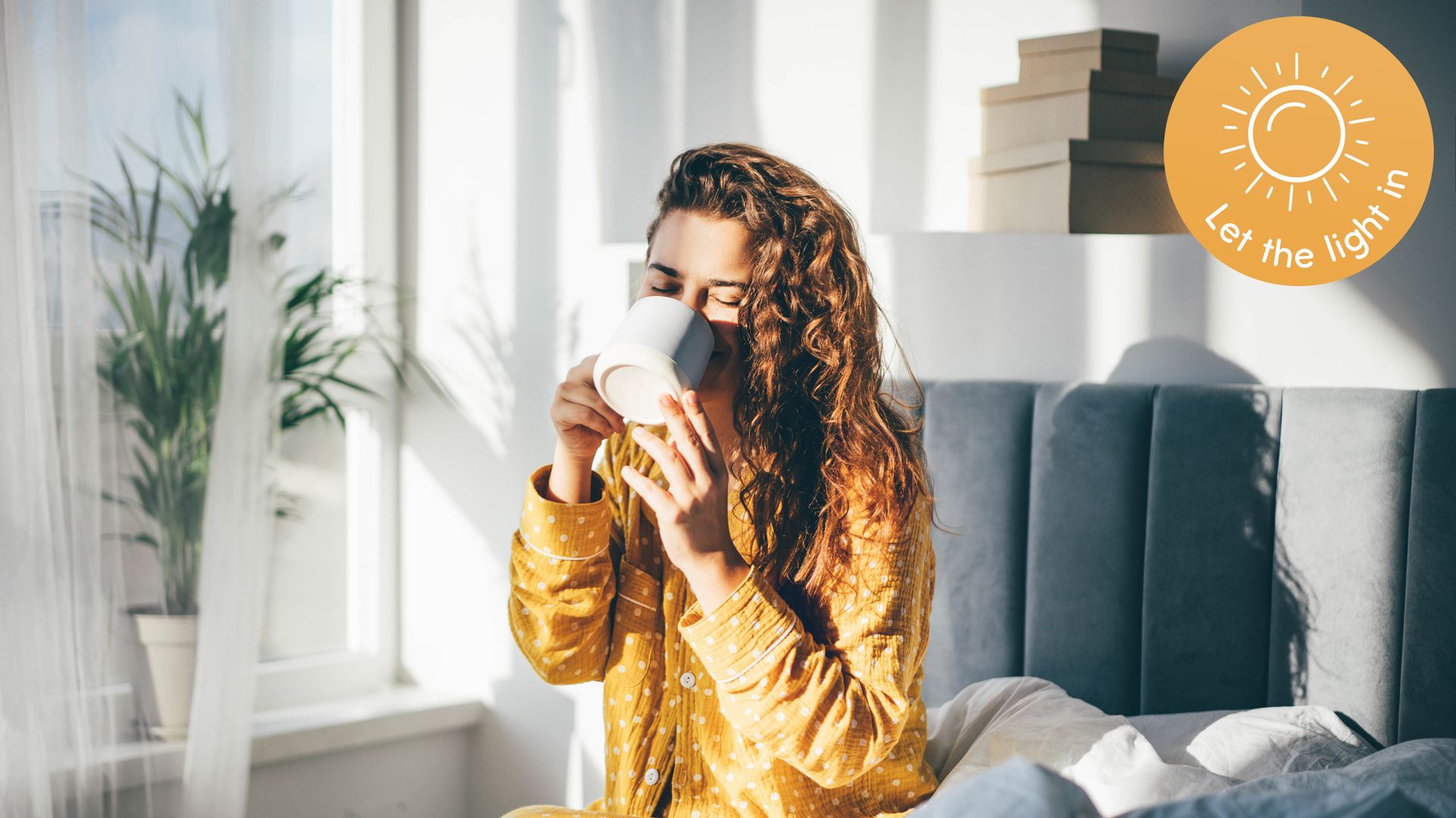 Woman sipping coffee in yellow pyjamas