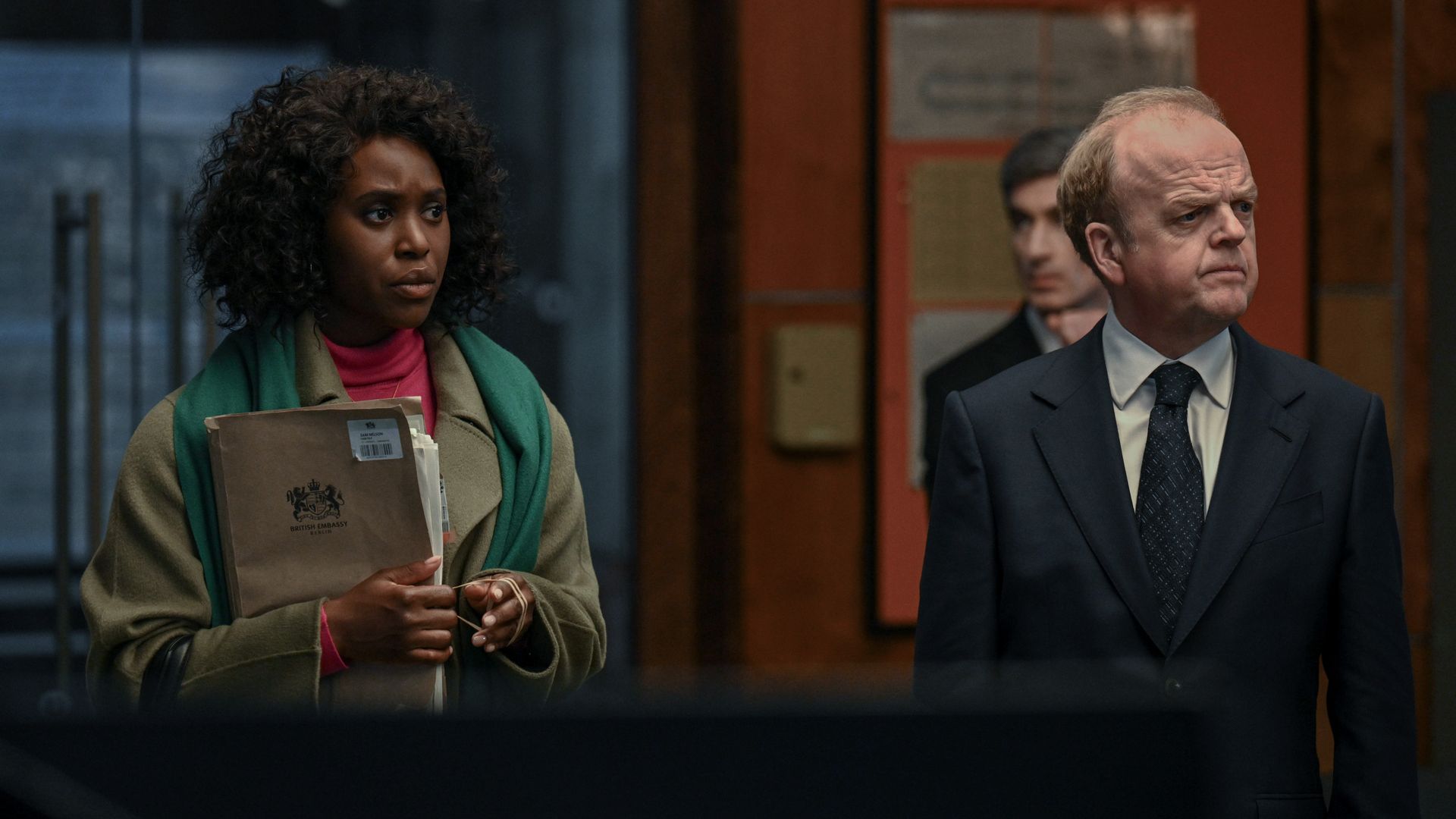 woman and man standing in office