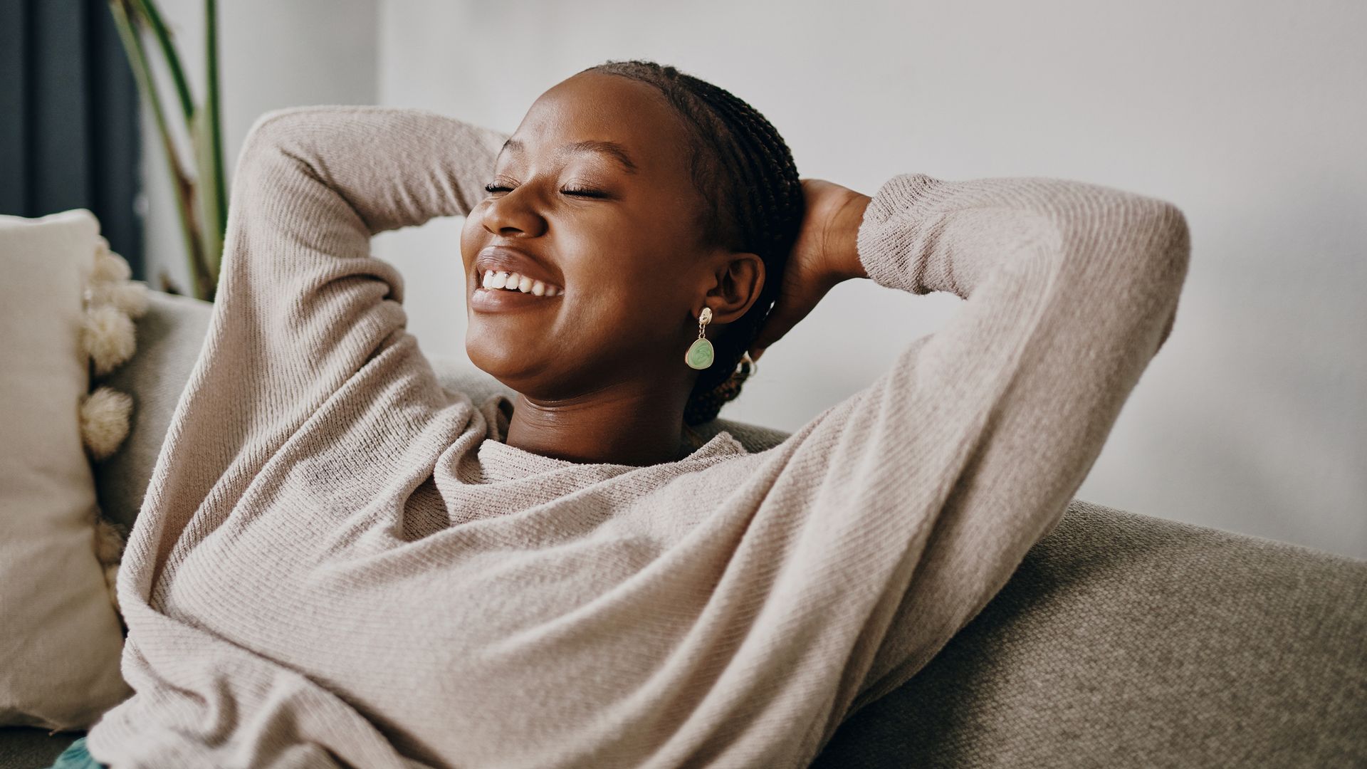 Shot of a young woman relaxing on the sofa at home