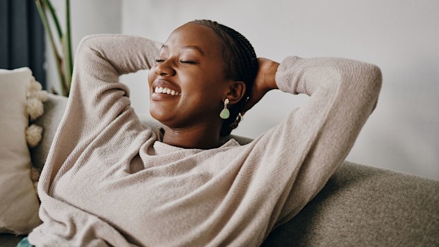 Shot of a young woman relaxing on the sofa at home