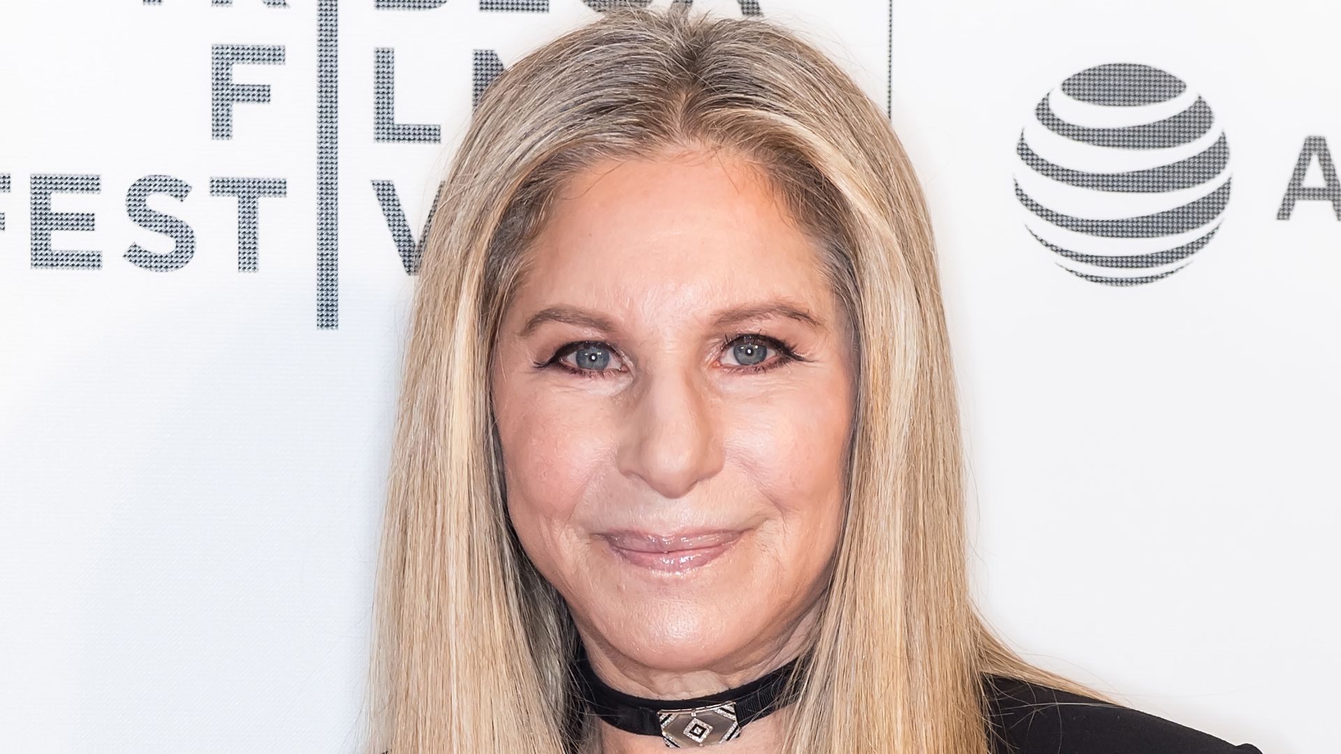 Barbara Streisand in black suit 