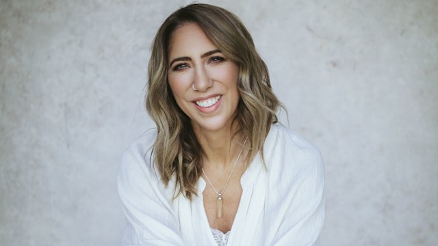 Woman sitting on a chair in white shirt