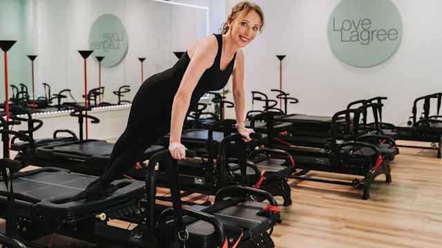 woman on a reformer Pilates machine 