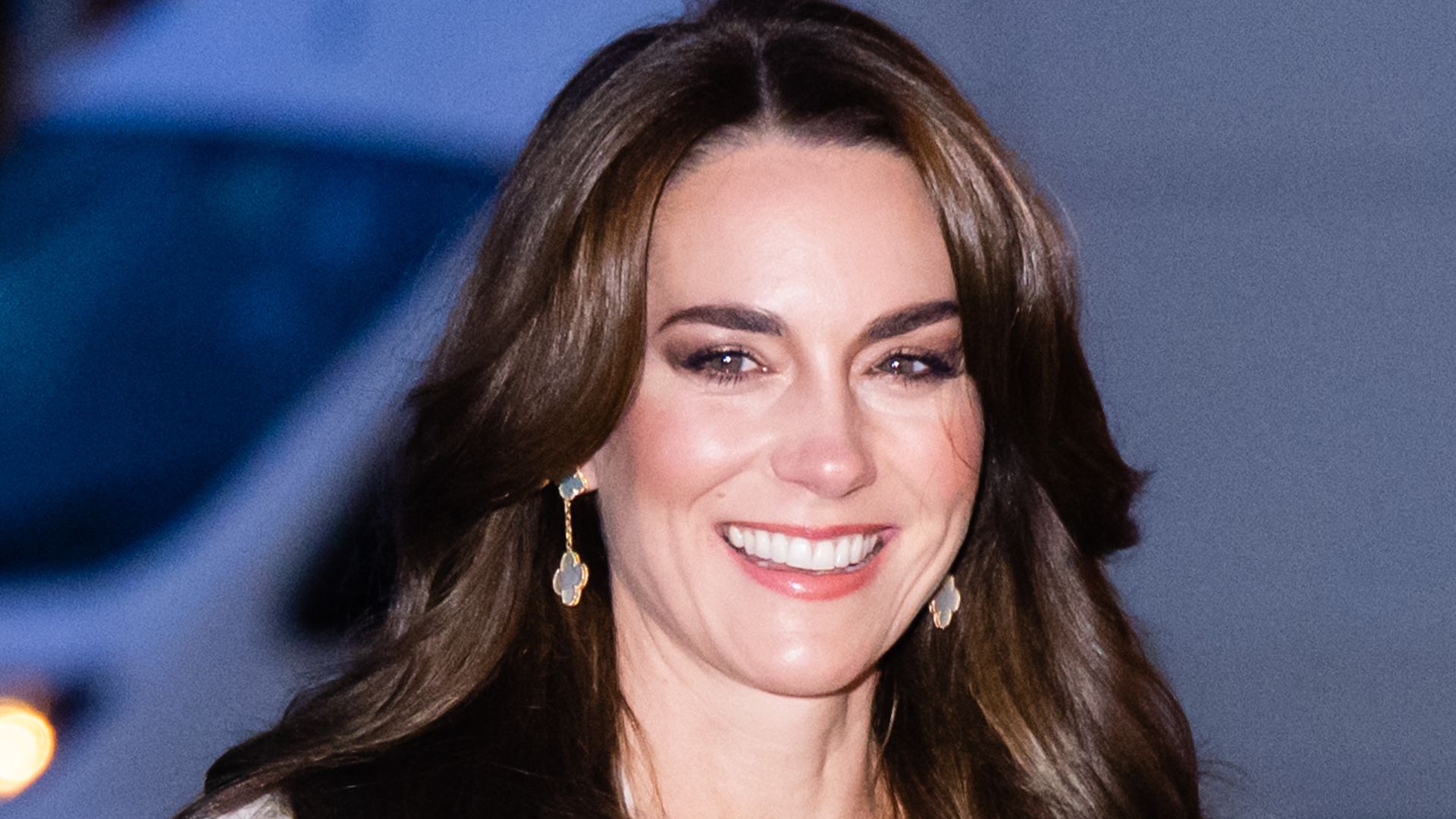 Kate Middleton smiling in white outfit