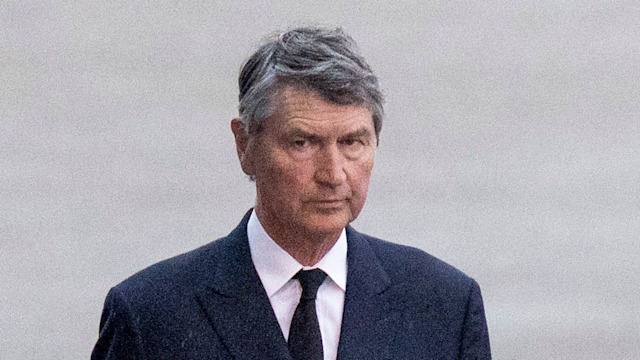 Vice Admiral Sir Timothy Laurence look on as Queen Elizabeth II's coffin arrives at RAF Northolt on September 13, 2022 in London