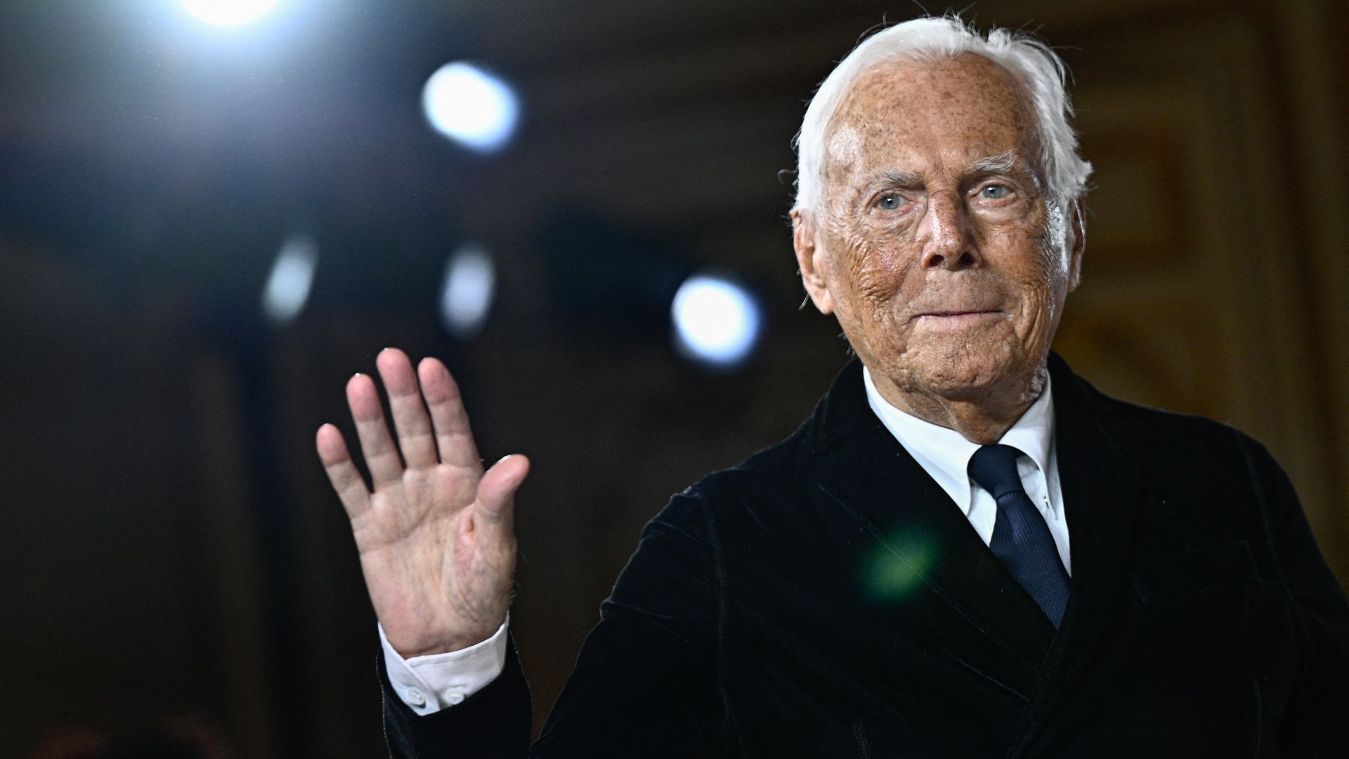 Italian designer Giorgio Armani acknowledges the applause at the end of his presentation for Armani Prive during the Women's Haute-Couture Spring/Summer 2025 Fashion Week to mark its 20th anniversary, in Paris on January 28, 2025. (Photo by JULIEN DE ROSA / AFP) (Photo by JULIEN DE ROSA/AFP via Getty Images)          