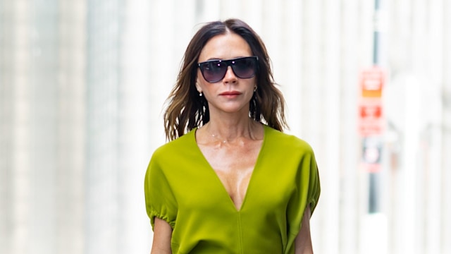 Victoria Beckham in NYC in a bright green dress